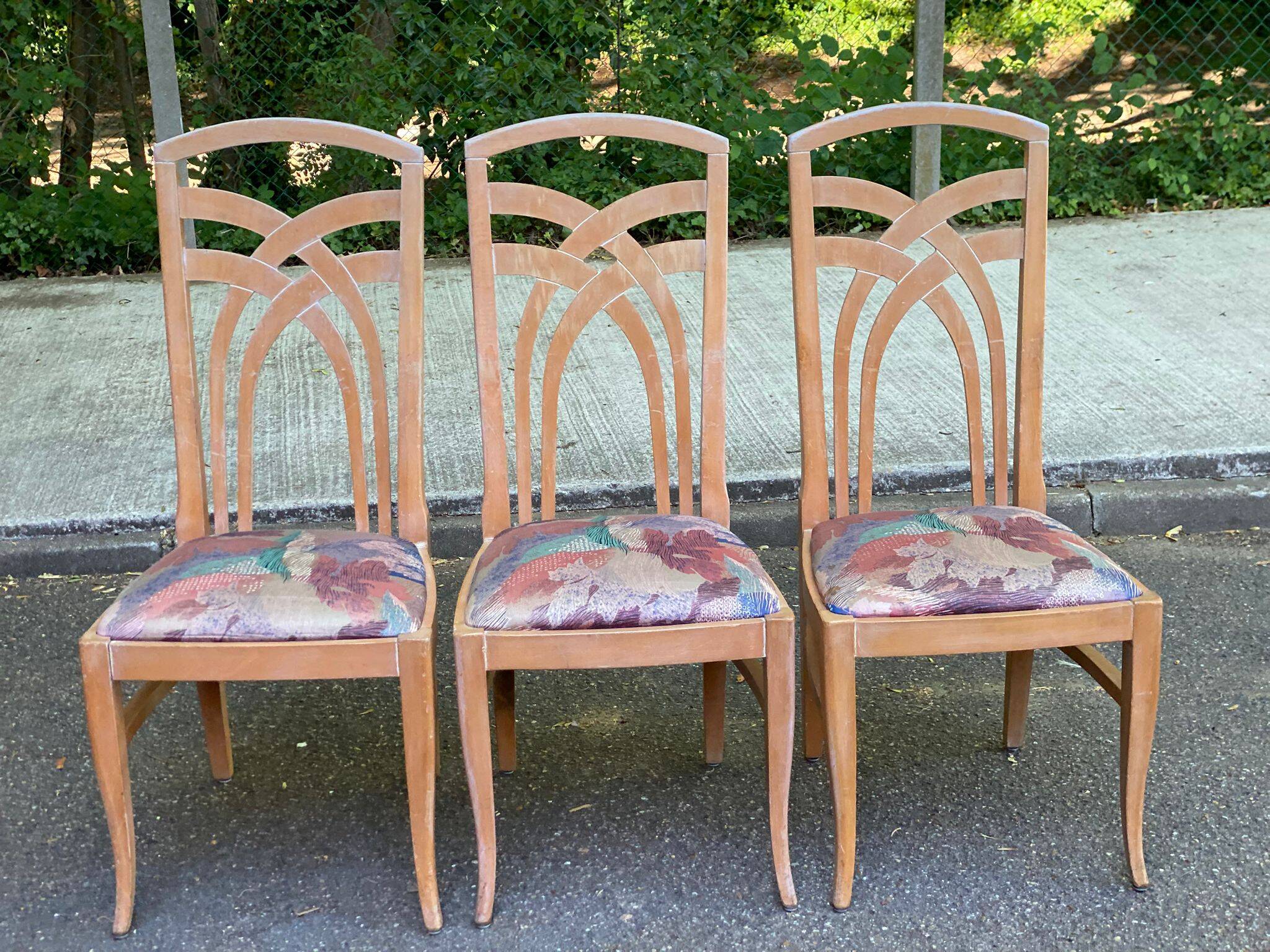2 dining or kitchen chairs with high backs and fabric.