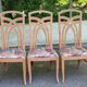 2 dining or kitchen chairs with high backs and fabric.