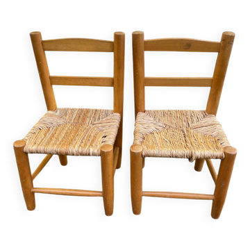 Pair of vintage children's chairs in wood and woven straw.