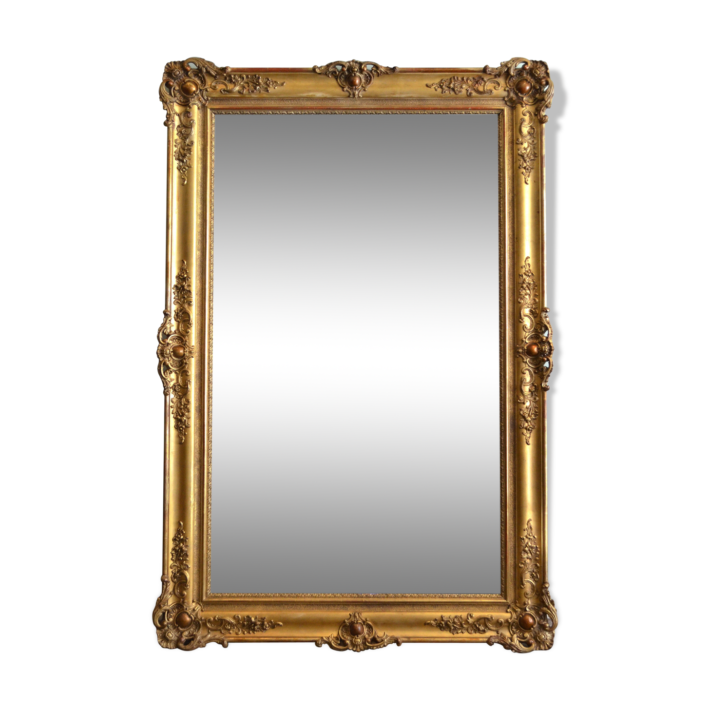 Nineteenth century monumental mirror in gilded wood
