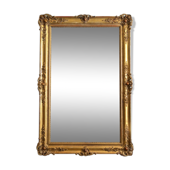 Miroir monumental du XIXème siècle en bois doré