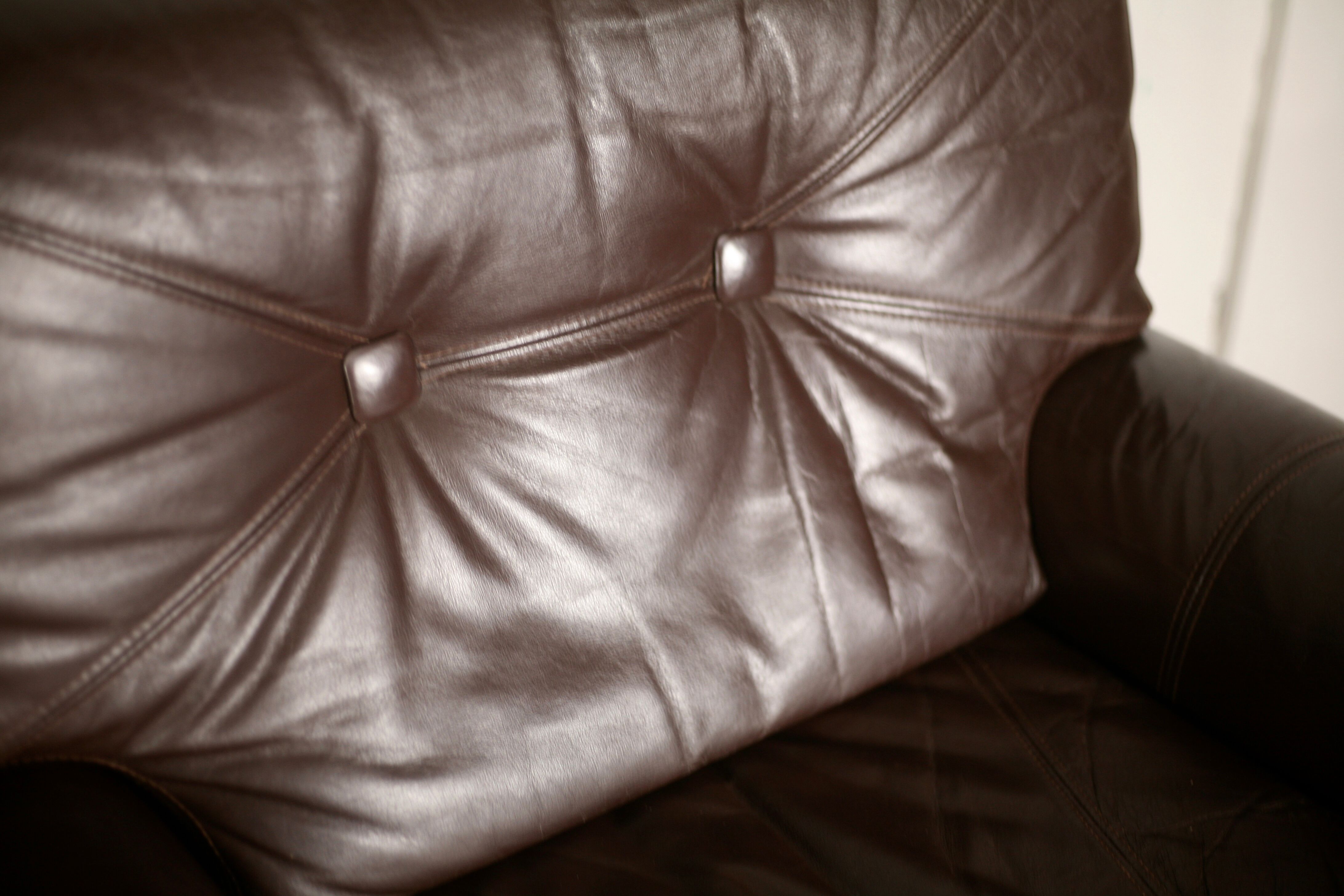 Pair of armchairs brown leather base stainless steel, France, circa 1970