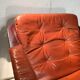 Duo of ochre leather and wood frame armchairs