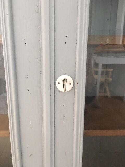 Vintage wooden cupboard and porcelain lock
