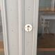 Vintage wooden cupboard and porcelain lock