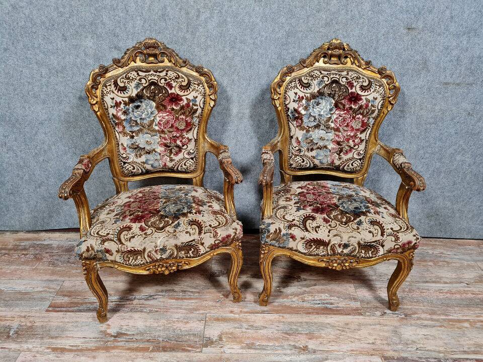 Pair of Louis XV style Baroque armchairs in gilded and carved wood circa 1900