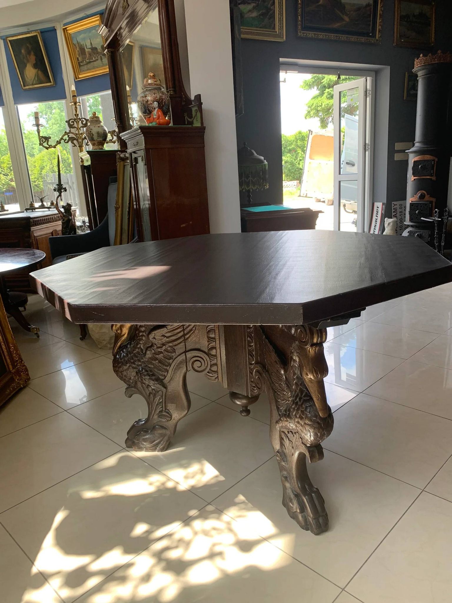 Octagonal oak table, 19th century, griffins