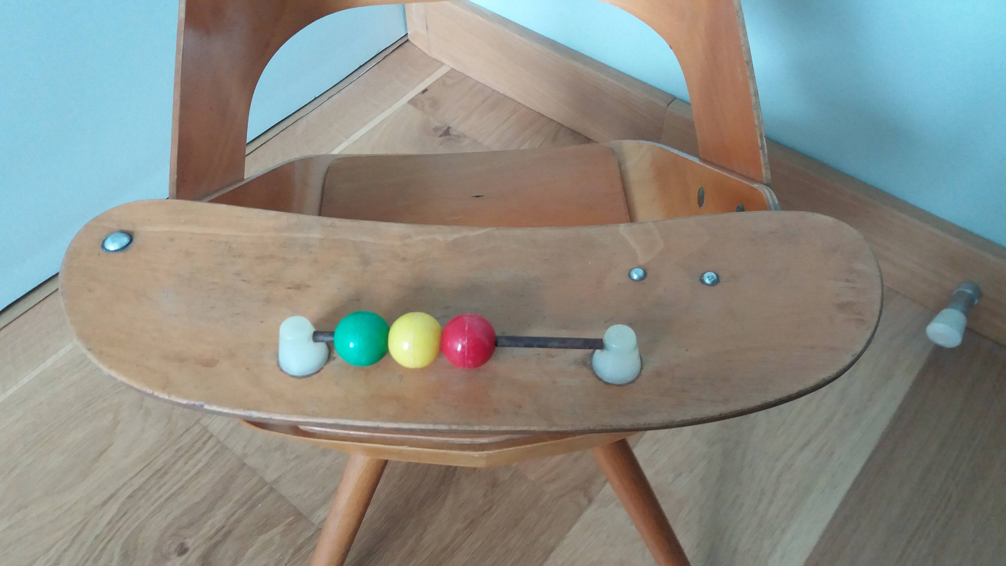 Baumann Baby Coquille children's armchair in bent wood with splayed legs.