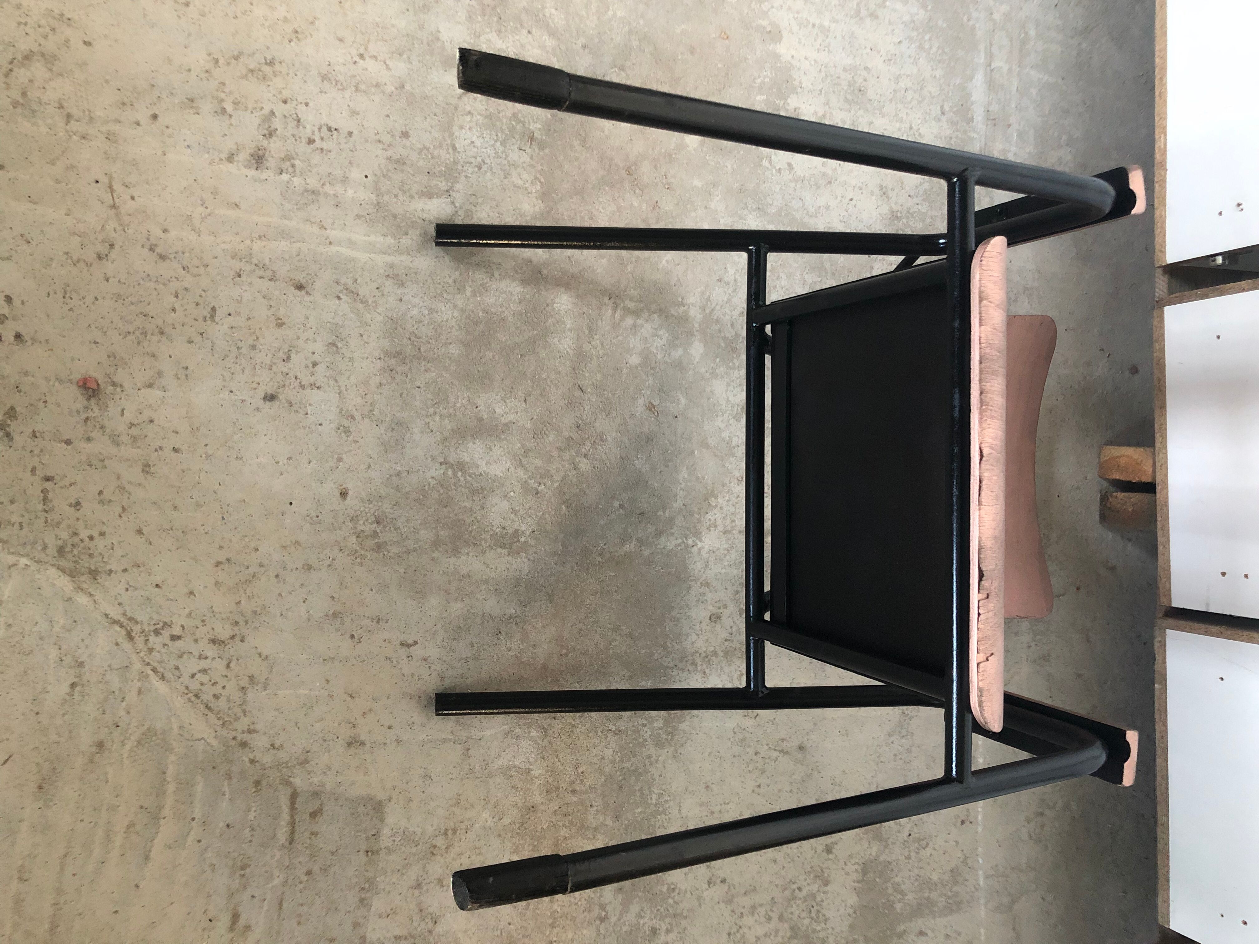 Old chair with armrest restored in metallic pink