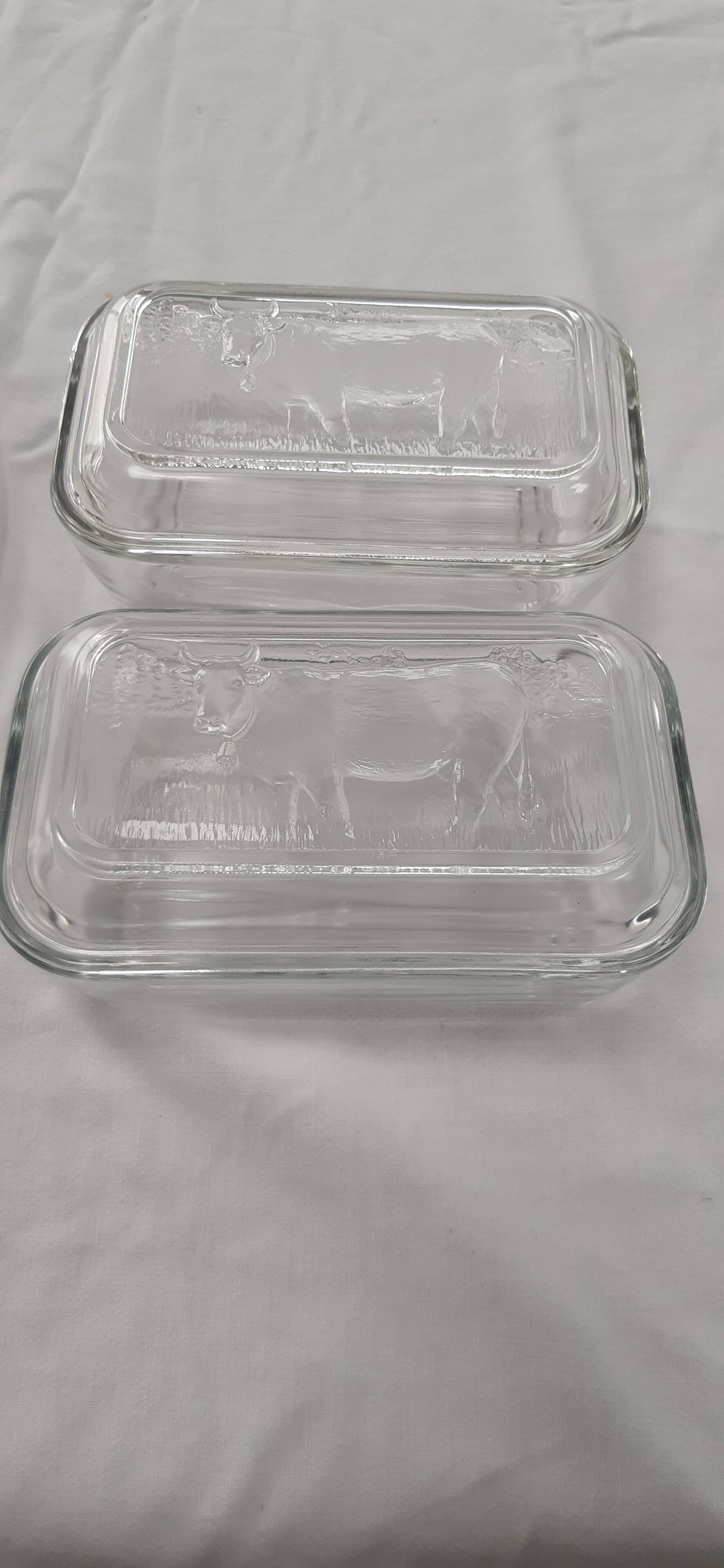 Two Arcoroc glass dairy cow butter dishes