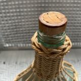 Wicker-sheathed glass bottle