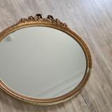 Ancien miroir ovale avec cadre doré