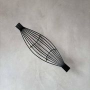 Minimalist black steel wire fruit bowl from the 1950s.
