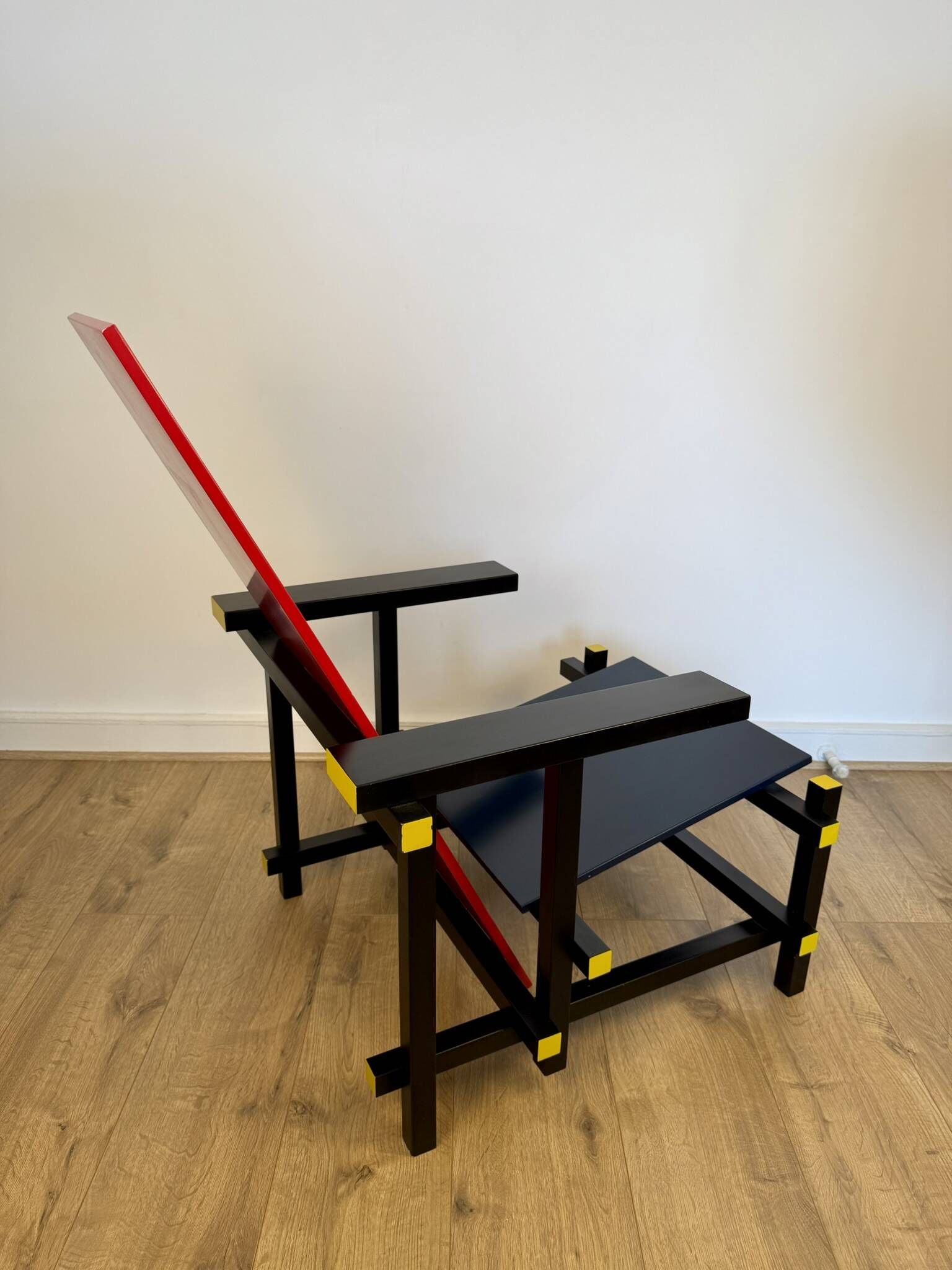 Red and Blue Chair in the Style of Gerrit Rietveld – De Stijl Movement