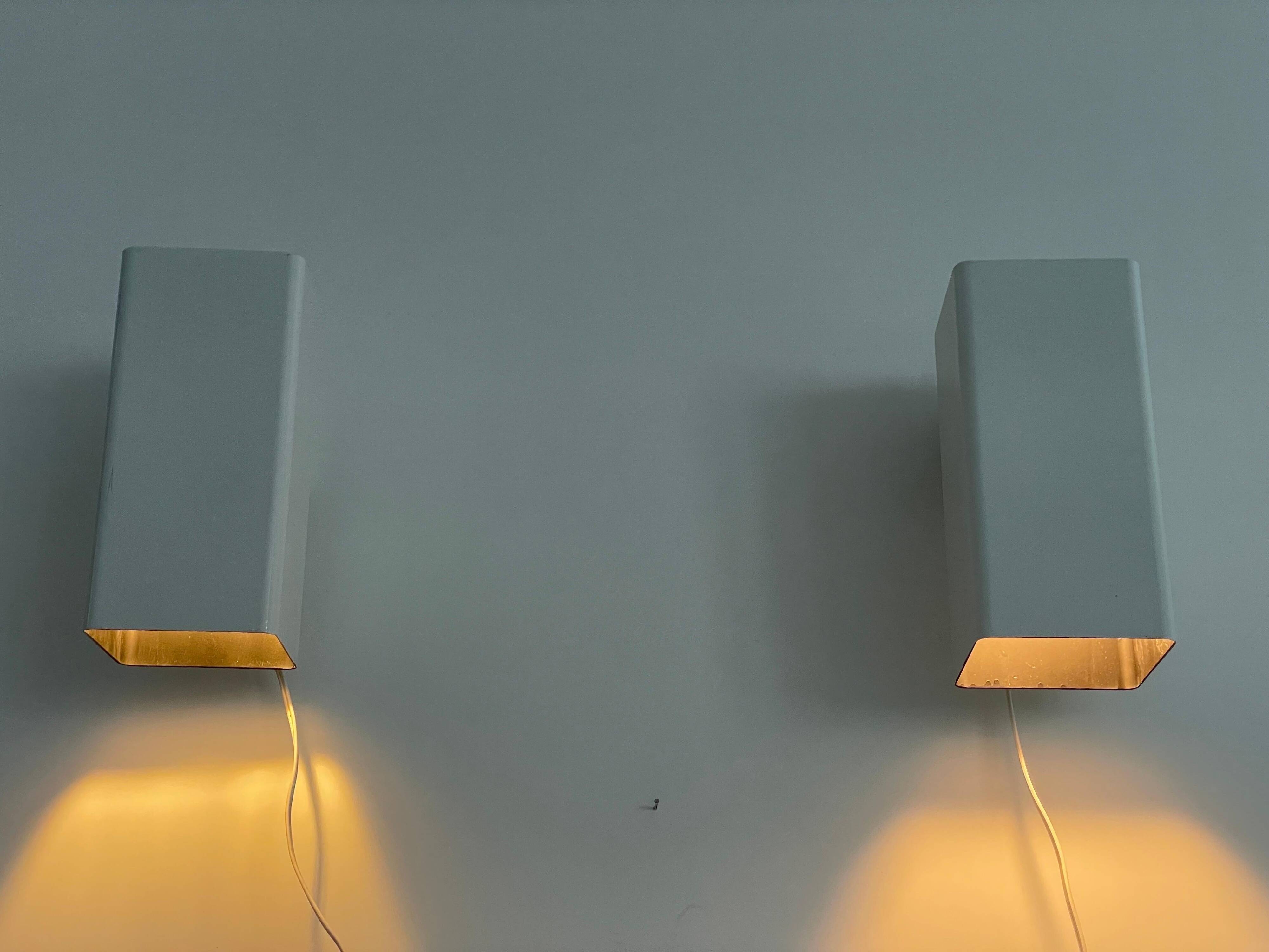 Pair of minimalist white metal wall lights from the mid-century, 1960, Germany.