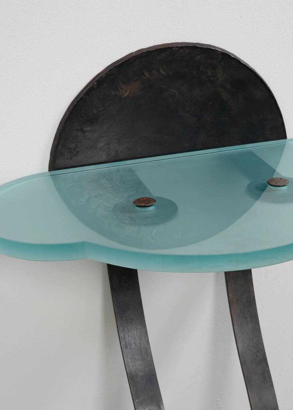 Artisanal wrought iron and cast glass leaning console table