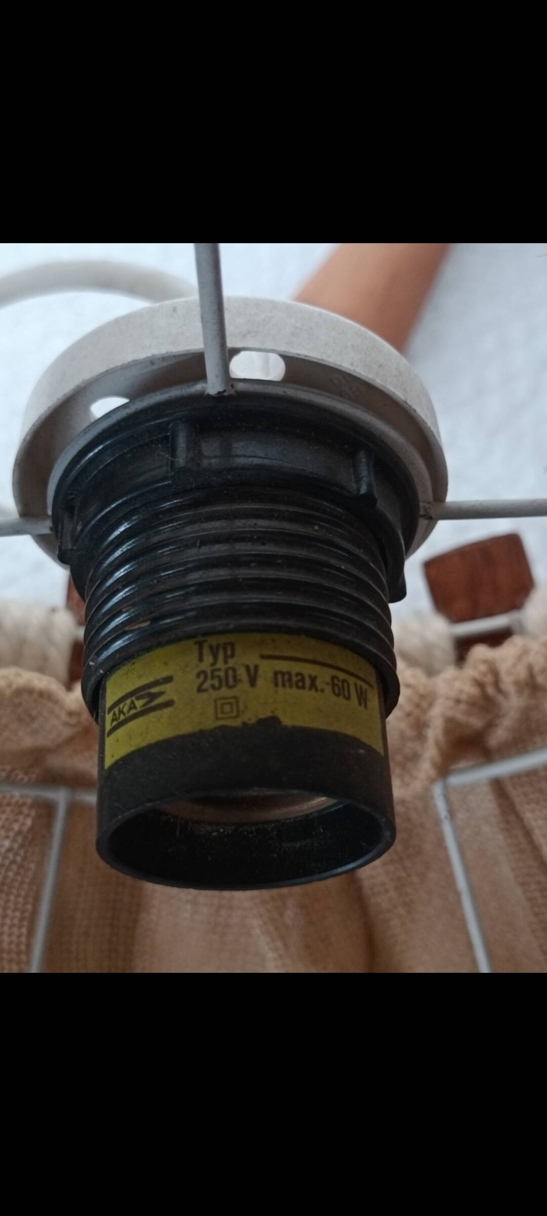 Hanging lamp with wood and cord from the 1990s.