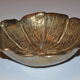 Empty-pocket flower in solid brass