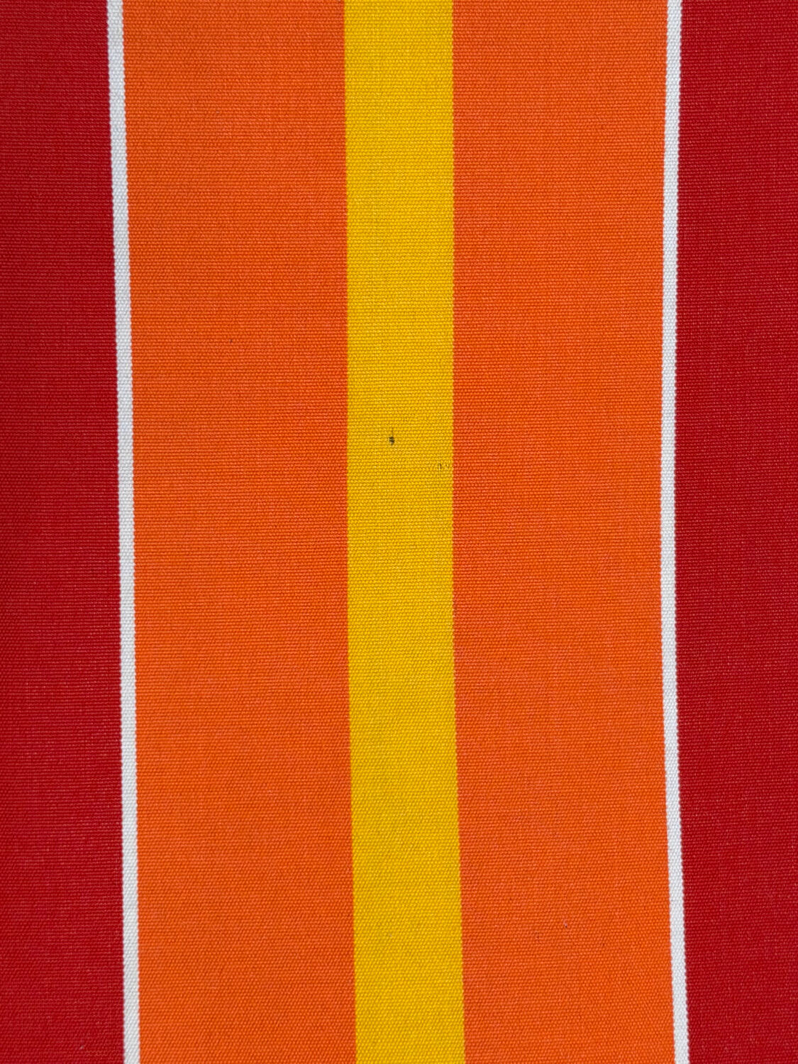 Vintage deck chair with red and orange striped fabric, original patina.