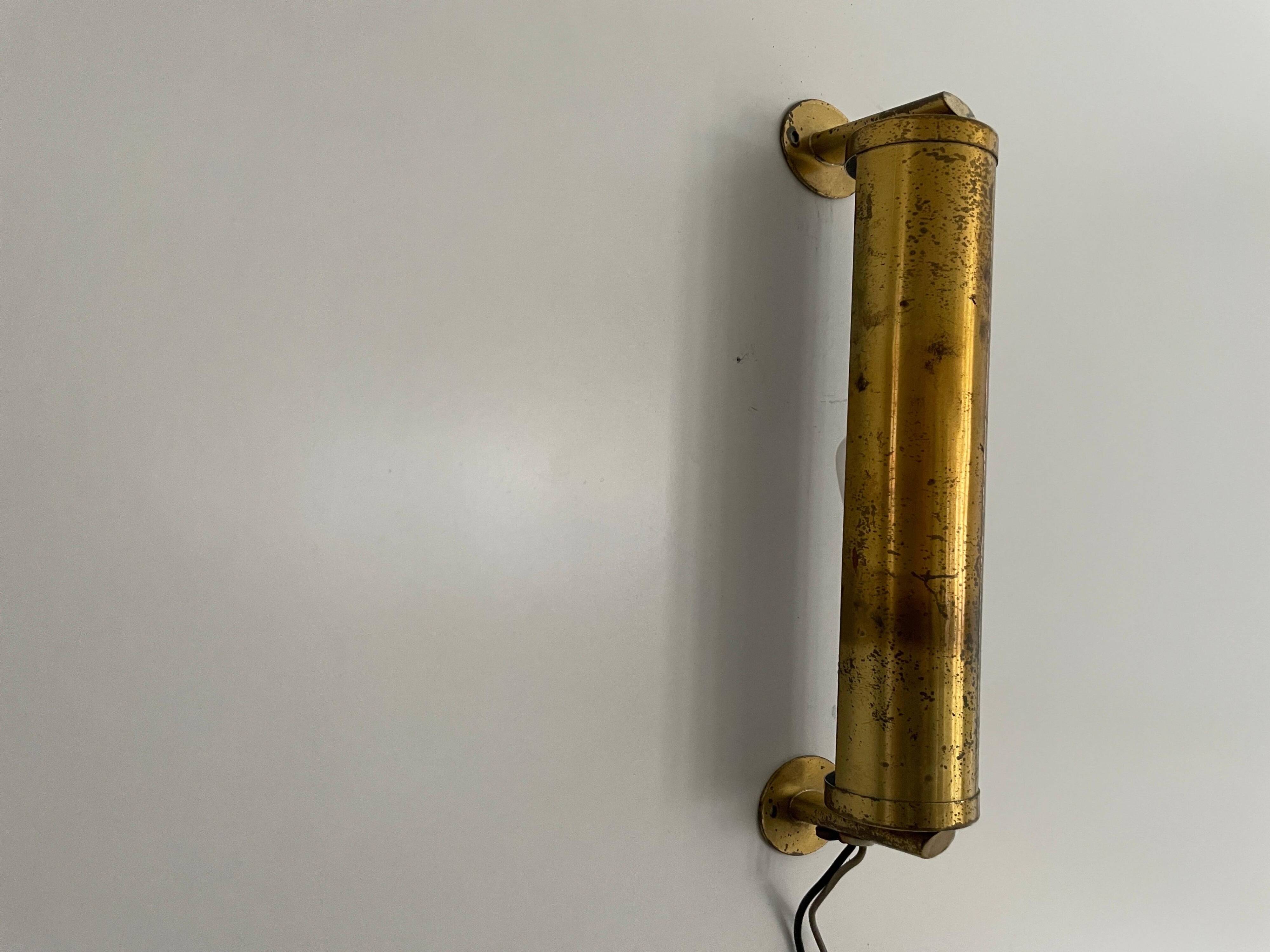 Small simple cylindrical brass wall light from the mid-century, 1950s, Germany.