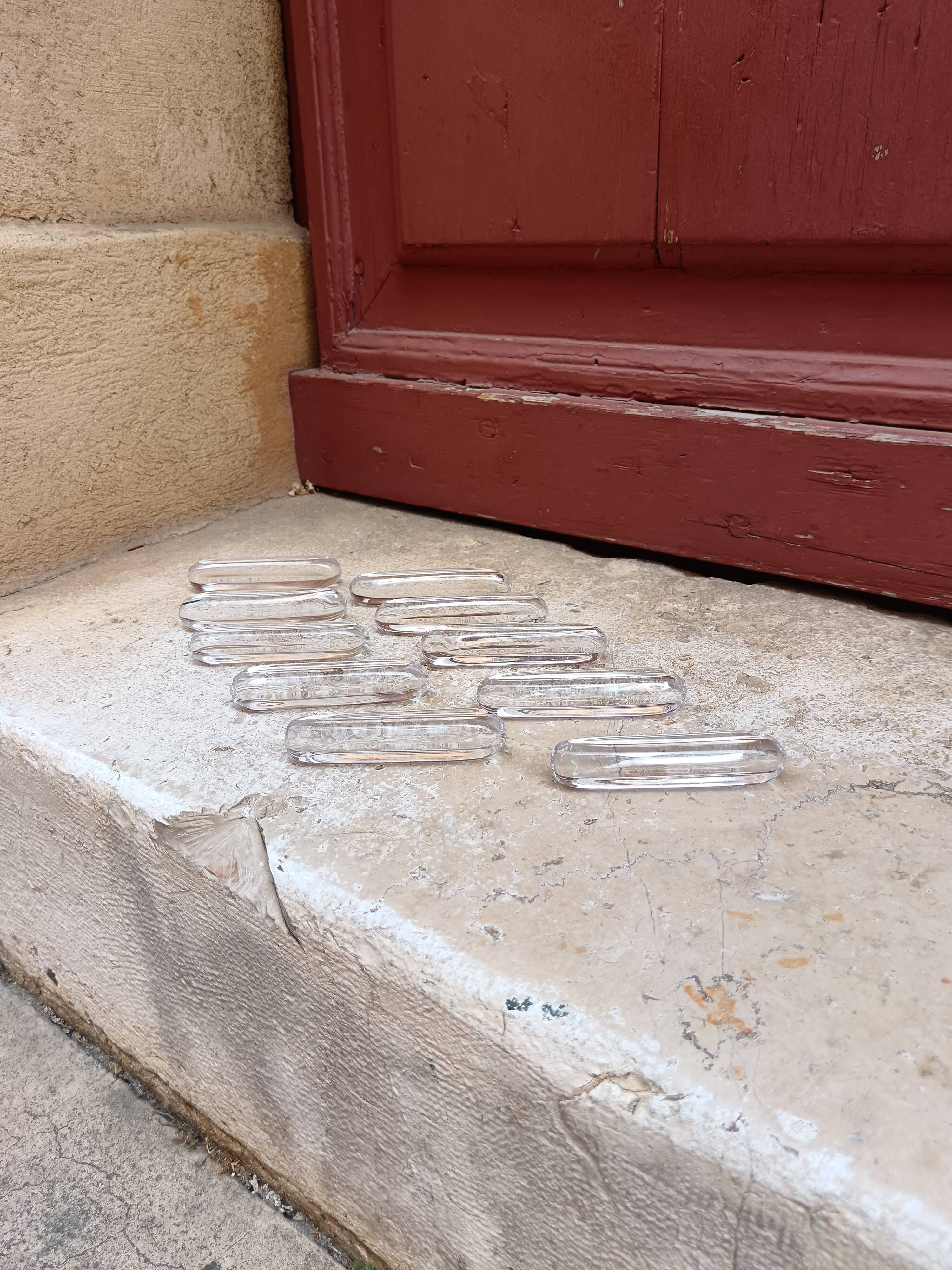 Set of 10 crystal knife rests by Daum.
