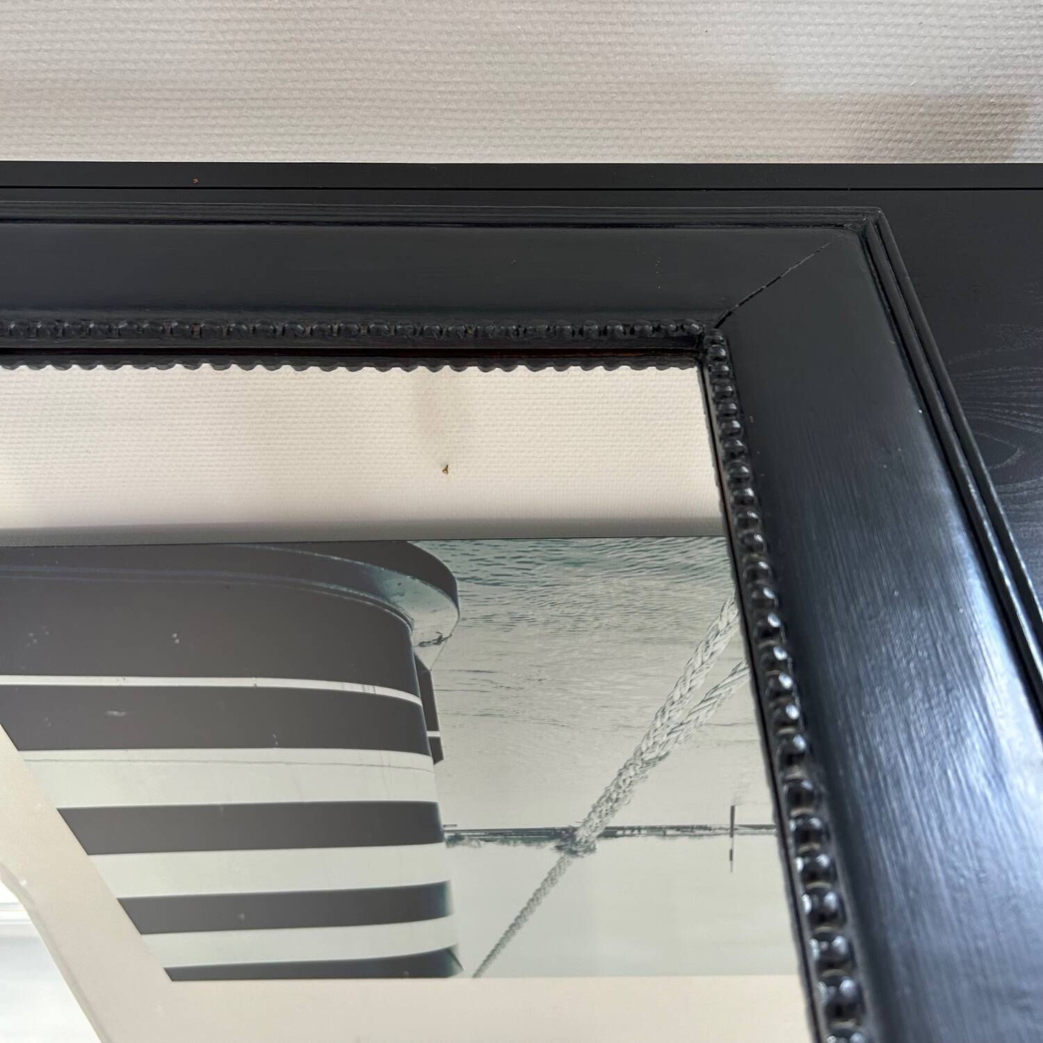 Pearled black frame mirror