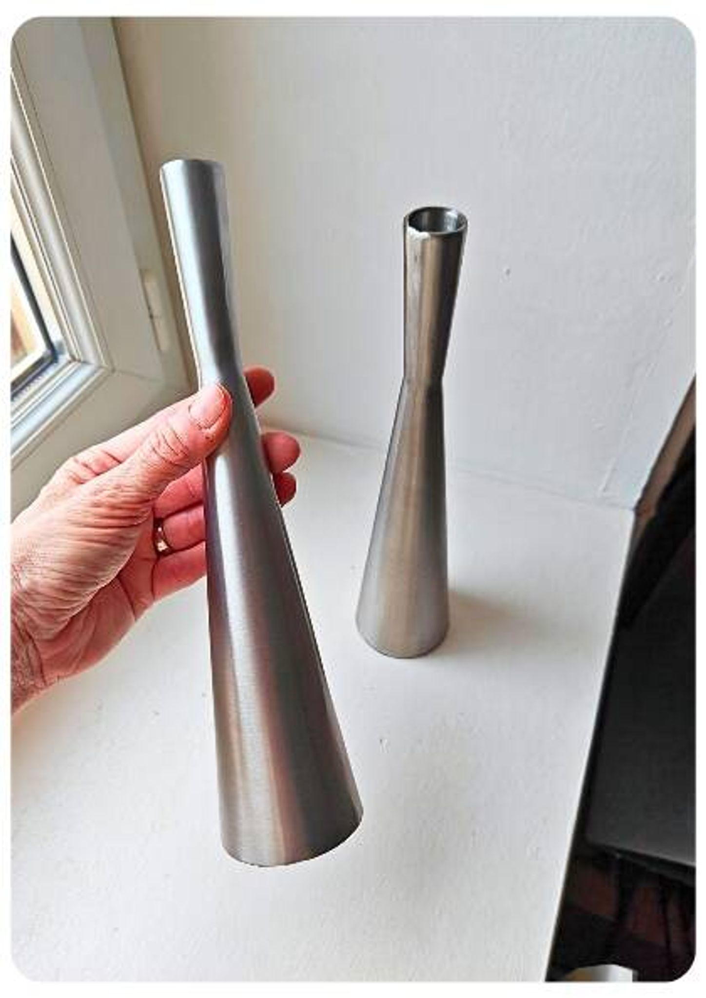 Pair of vintage brushed metal candlesticks