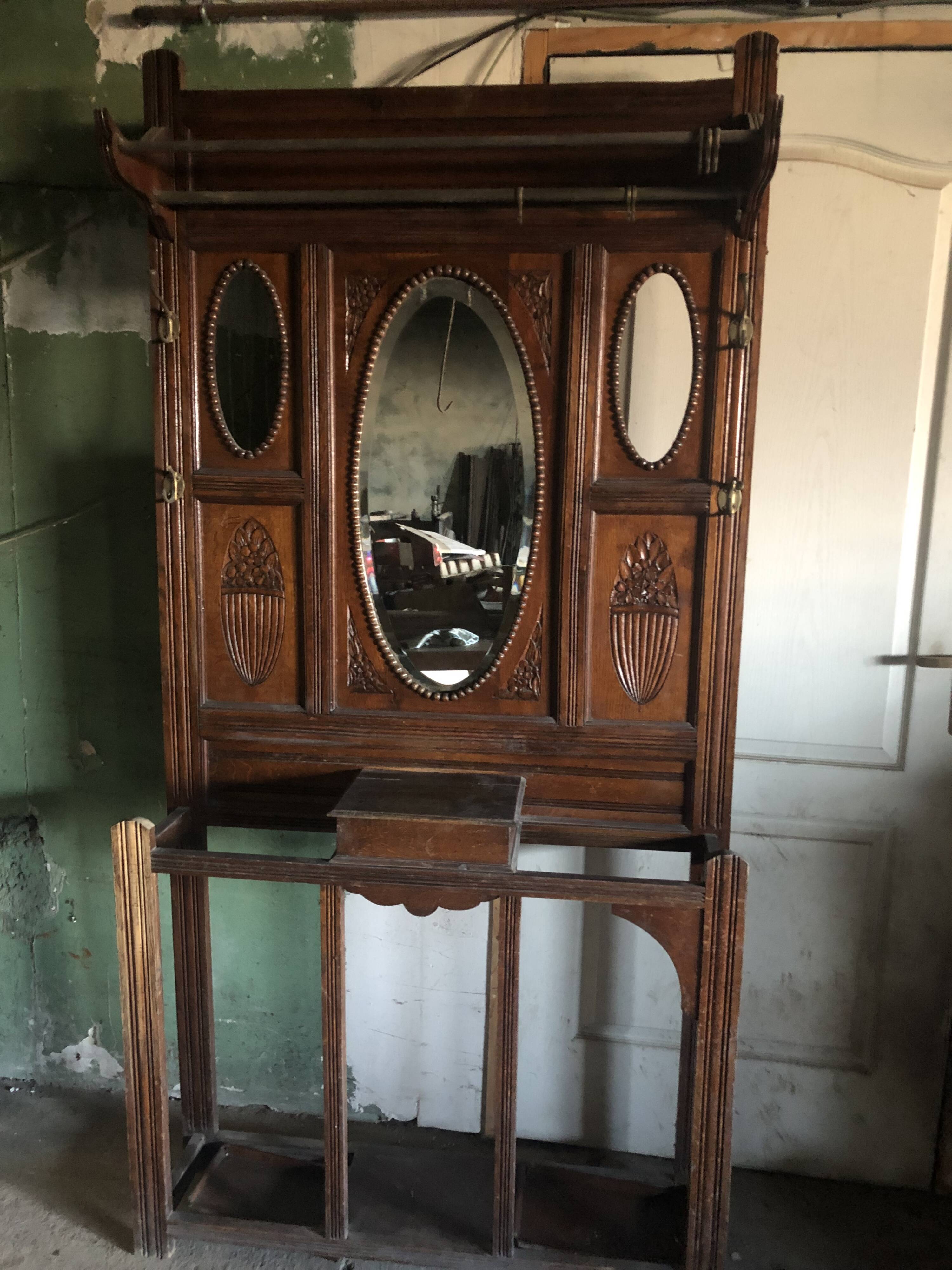 Very decorative coat rack with bevelled mirror.