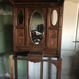 Very decorative coat rack with bevelled mirror.