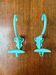 Pair of painted metal wall hooks