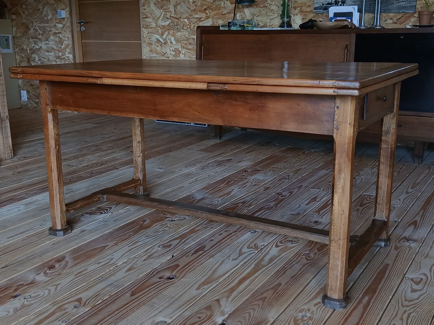 Elm farmhouse table with extensions for 6 to 10 people.