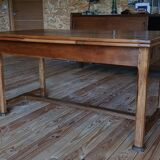 Elm farmhouse table with extensions for 6 to 10 people.