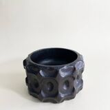 Brutalist wooden pocket emptier