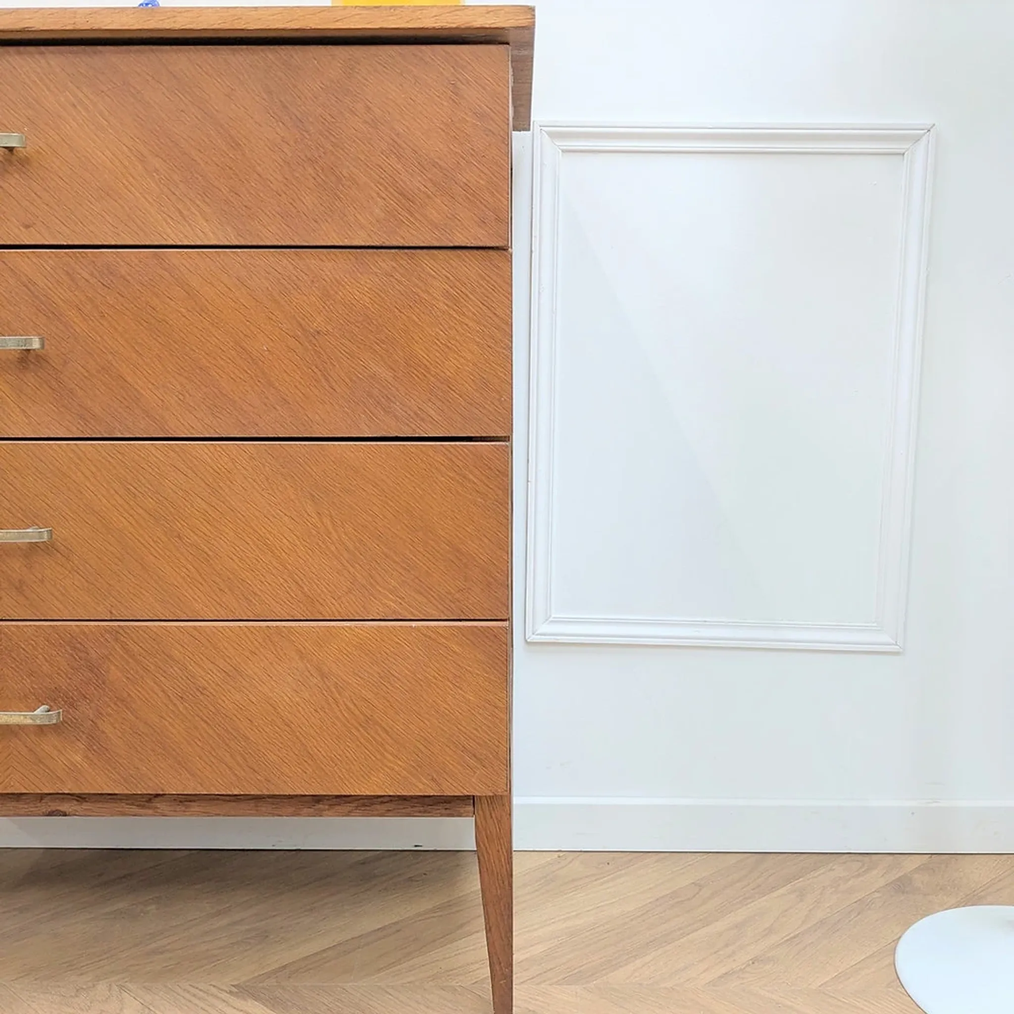 Vintage French commode from the 1950s with tapered legs and oak.