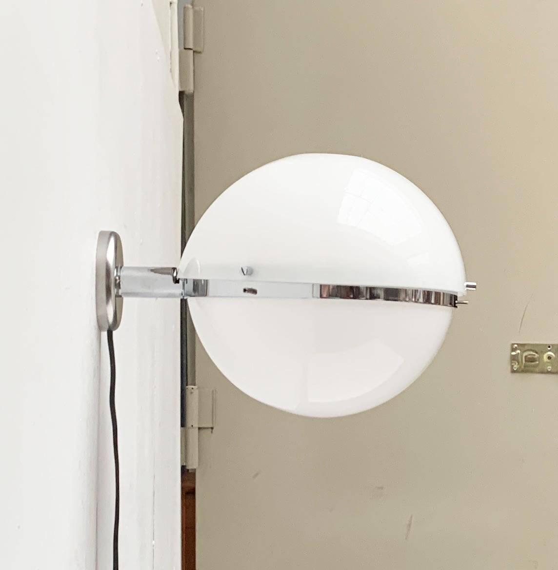 Mid-century Italian space age spherical wall light by Guzzini.