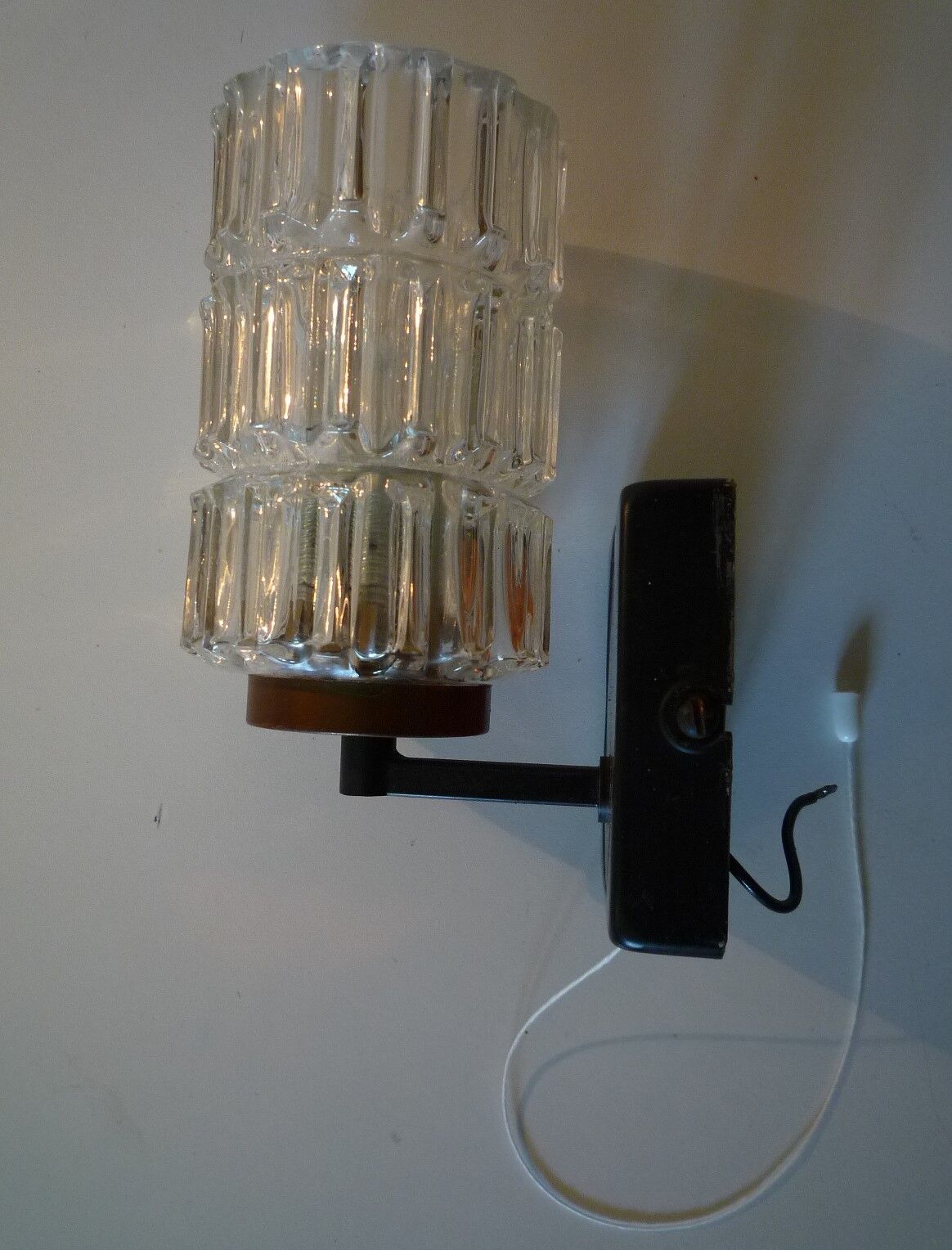 Pair of black lacquered metal, brass and glass wall light
