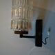 Pair of black lacquered metal, brass and glass wall light