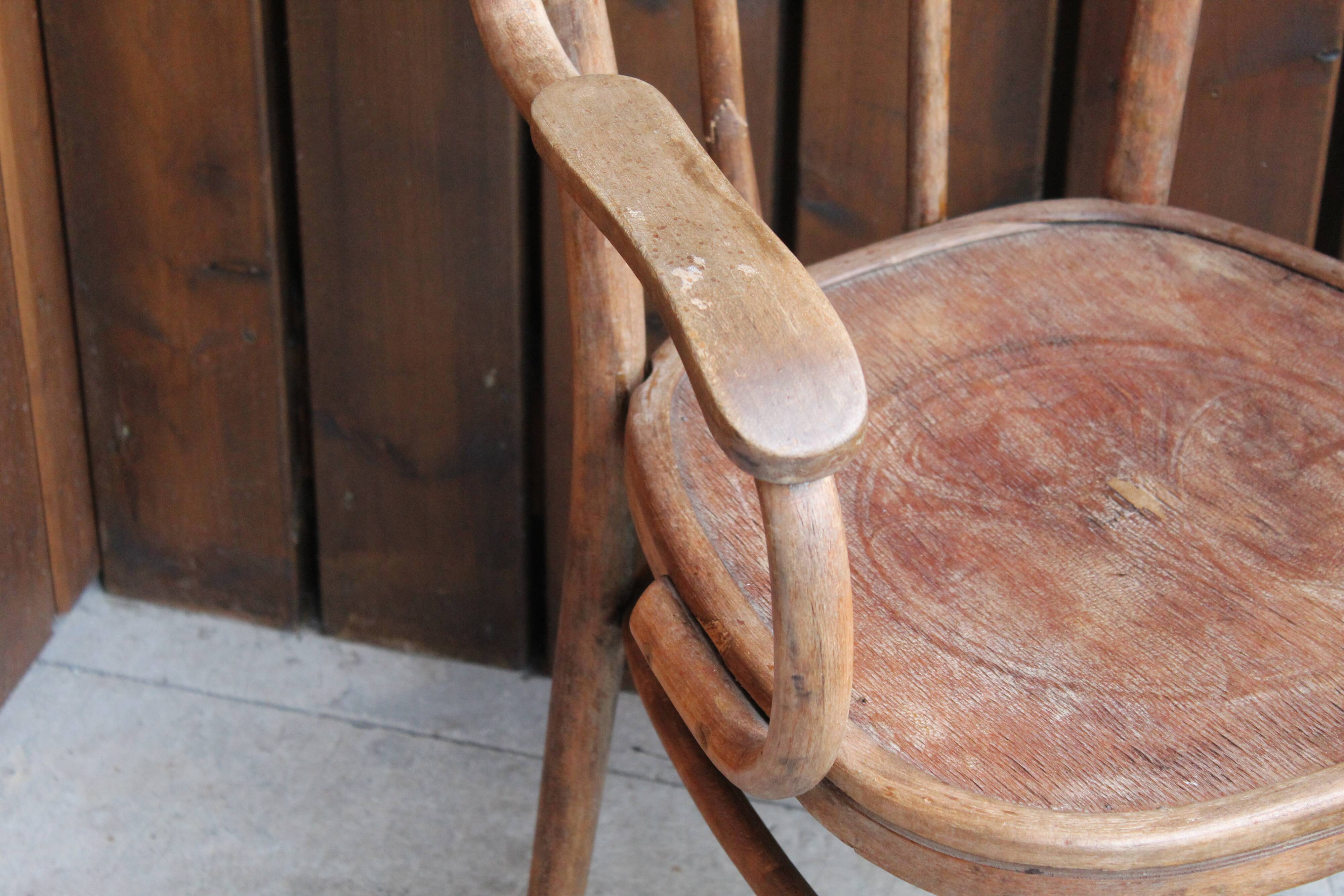 Curved wooden armchair