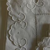 Pair of 19th century linen thread pillowcases embroidered with scallops