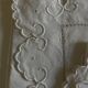 Pair of 19th century linen thread pillowcases embroidered with scallops