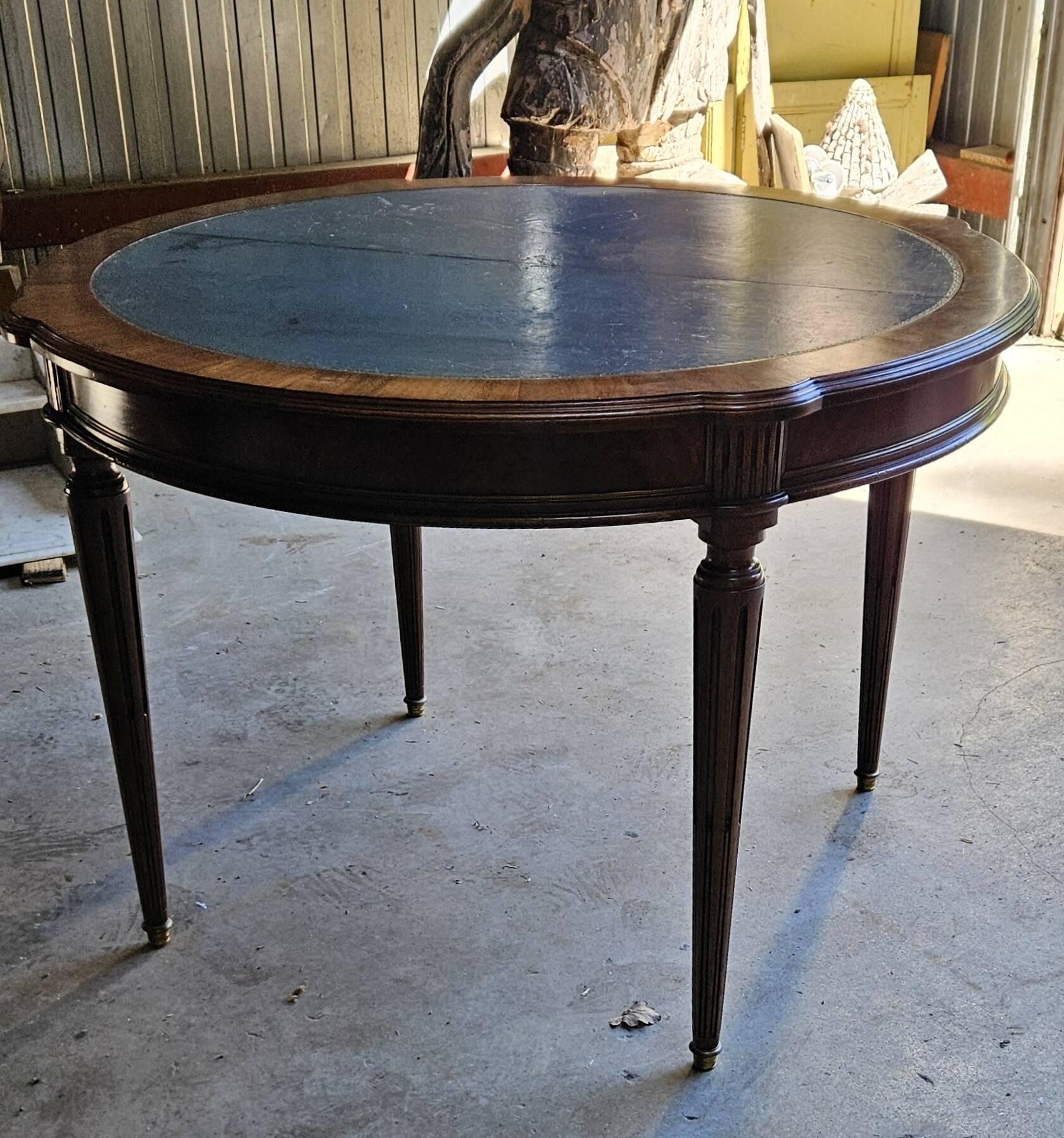 Elegant game table or circular extending side table in Louis XVI style.