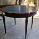 Elegant game table or circular extending side table in Louis XVI style.