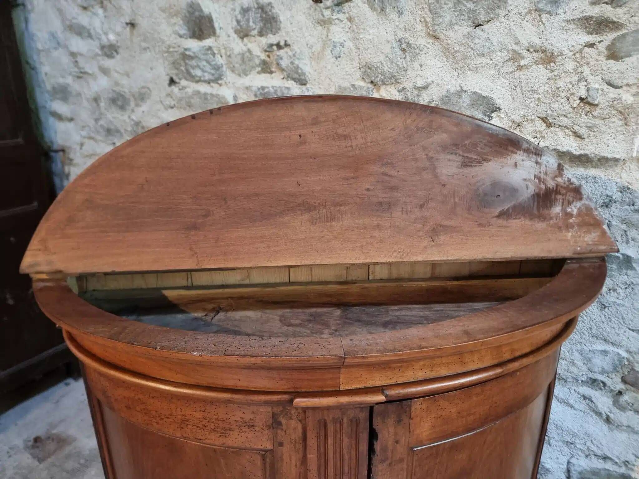 Antique demi-lune cabinet in walnut, late 18th century, French château.