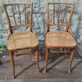 Set of 2 antique bistro chairs. Curved and turned wood.