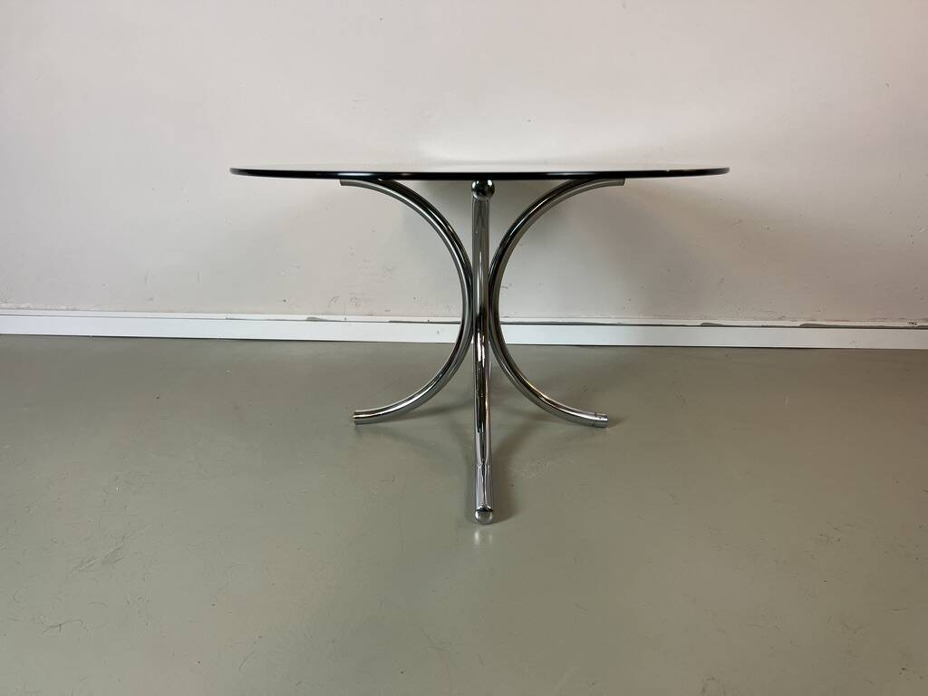 Vintage coffee table from the 70s in smoked glass and chrome, oval, Space Age style.