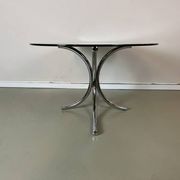 Vintage coffee table from the 70s in smoked glass and chrome, oval, Space Age style.
