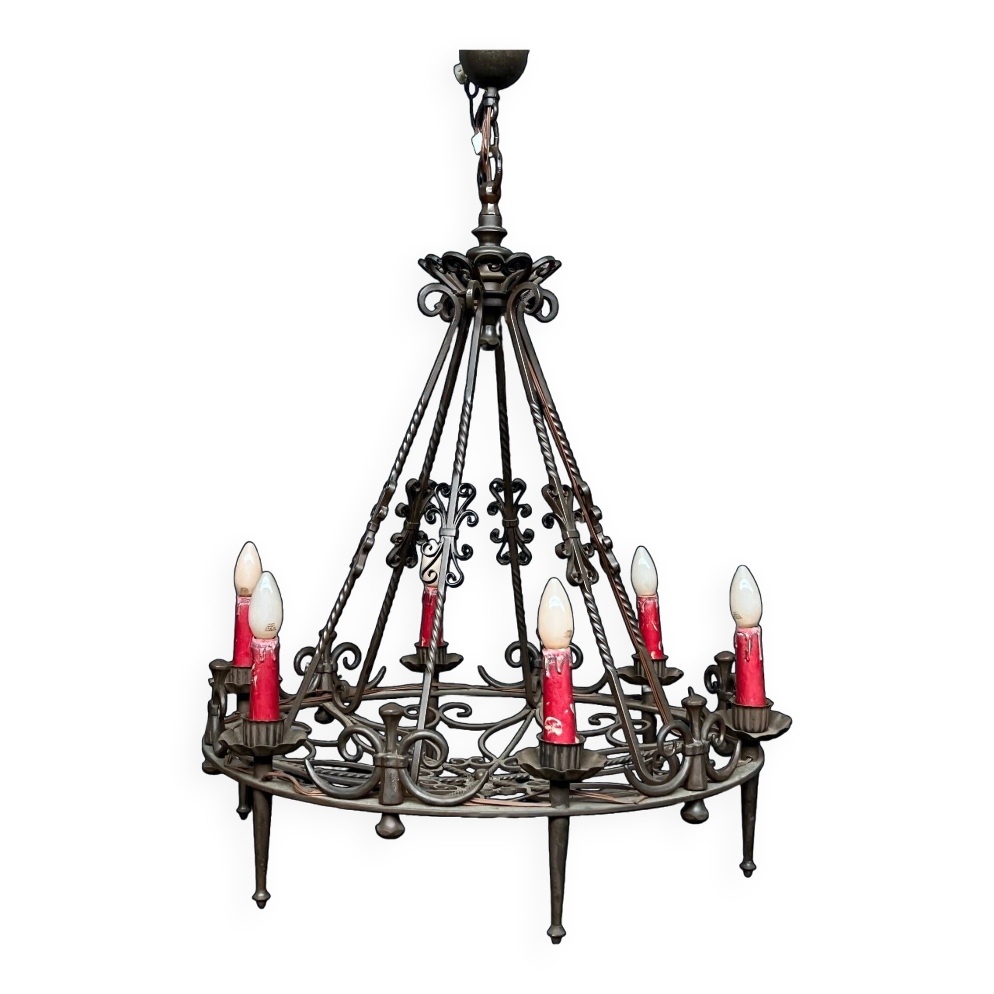 Wrought chandelier in Gothic style.