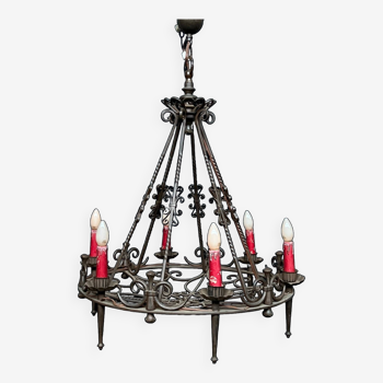 Wrought chandelier in Gothic style.