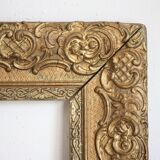 Gilded wooden and stucco frame