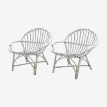 Pair of white rotin armchairs
